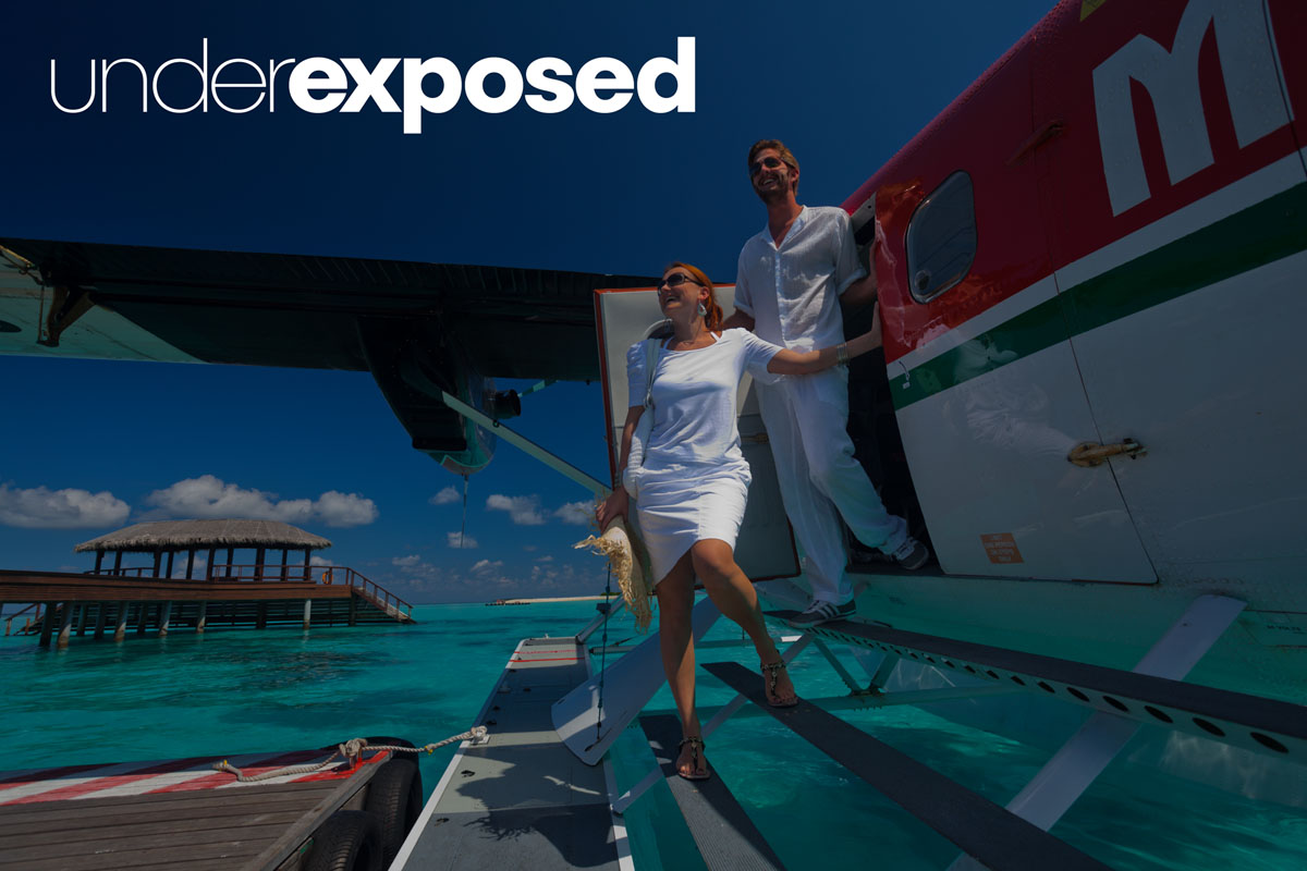 underexposed image of couple exiting seaplane